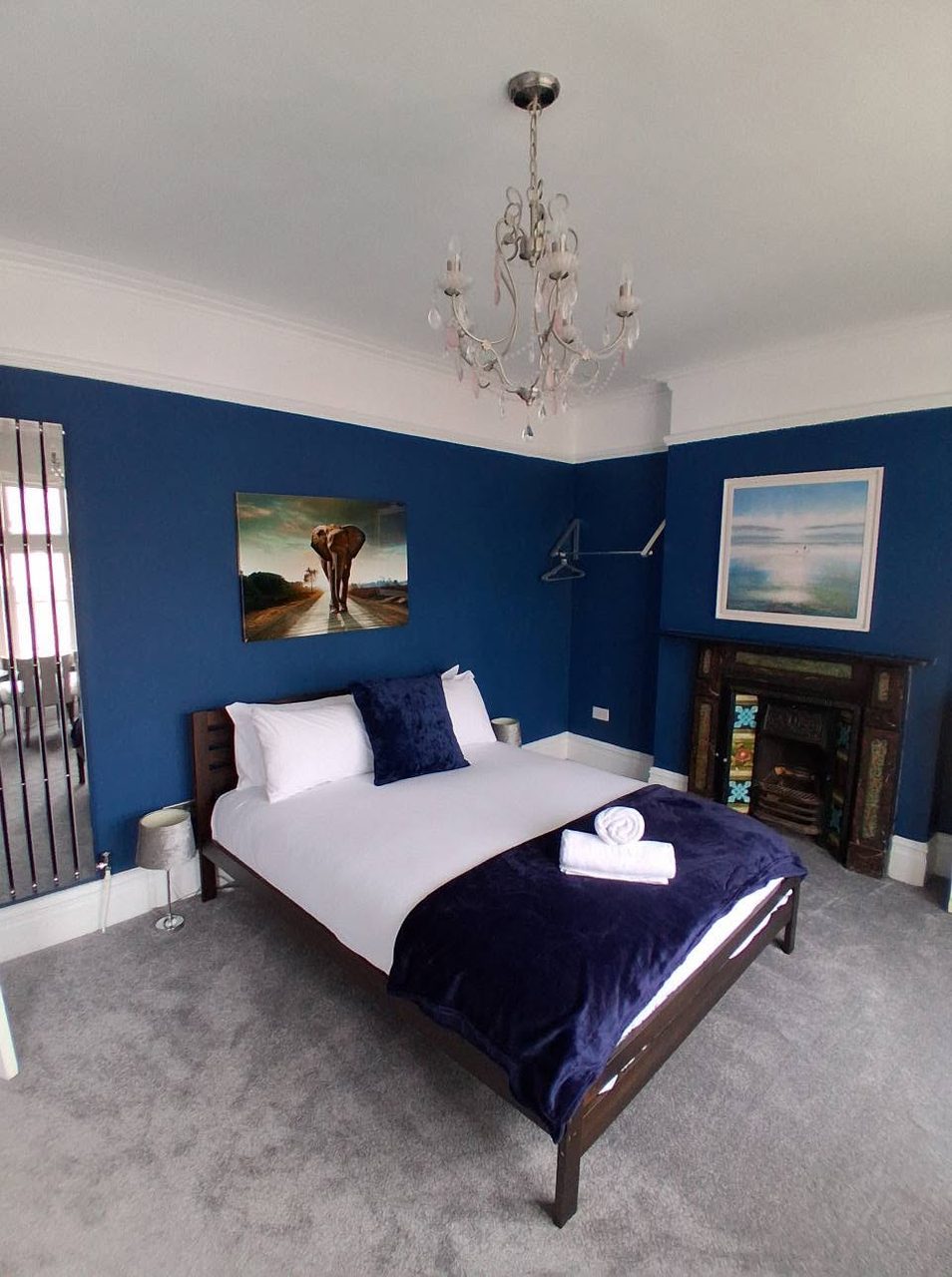 Master bedroom in rich navy